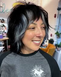 My favorite tool is my little red @jataifeather razor. Whether using it for  an entire haircut, or in finishing details, you won't catch me without that  guy! I love finishing these styles