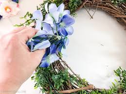 Though the wood looks great, any rustic piece will do. Floral Explosion Summer Dollar Store Wreath Diy The Happy Housie