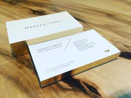 This business card design for berkshire hathaway affiliates uses color to grab attention. 28 Real Estate Business Cards We Love