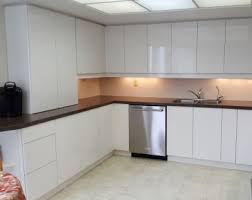 White paint and wood grain have long been the most popular finishes for kitchen shelves and cabinetry. Kitchen Cabinet Refacing In High Gloss Slab Doors With Push To Open Technology