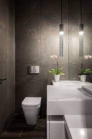 At least 21 in front of the toilet and sink for leg room. How To Design A Picture Perfect Powder Room