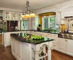 While many homeowners feel like choosing white countertops is a safe choice, selecting a slab of absolute black, black galaxy, or jet mist granite can deliver the same versatility and design. Traditional White Kitchen Cultivate Com Tuscan Kitchen Antique White Kitchen Antique White Kitchen Cabinets