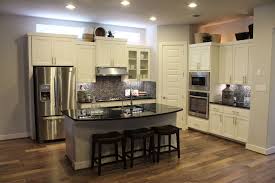 White oak flooring may appear discolored, depending on its finish. Choose Flooring That Complements Cabinet Color Burrows Cabinets Central Texas Builder Direct Custom Cabinets