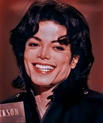 Michael Jackson often bites his lower lip subconsciously and smiles, I love  it.
