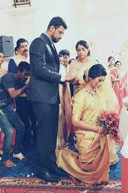 Tieing The Knot Kerala Christian Wedding Christian Bridal Saree Bridal Hairstyle Indian Wedding Christian Bride