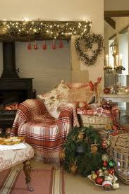 Decking out your house with christmas decorations that set the mood. A Comfortable Christmas Cottage Interior Jo Sheldrake Photography Christmas Interiors Beautiful Christmas Cosy Christmas