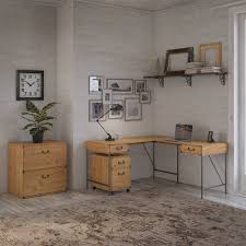 I tried to figure out what i should do with it, and with a little help from hometalk we decided on i used my sander to sand down the putty to make it level, and i sanded all the sides and edges. Ironworks 60w L Shaped Desk With File Cabinets By Kathy Ireland Home Overstock 29861536