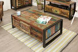 The table has lacquer coating to it, making it shiny and allowing every piece to display its natural cracks and grain. Shoreditch Reclaimed Coffee Table With 4 Drawers Coffee Tables