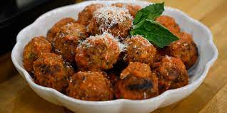 Michael Symon Makes Meatballs Extra Tender With A Secret Ingredient Recipe Ricotta Meatballs Recipes Food