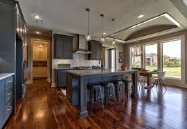 Rodrock Homes Summerlin Ex Features A Gourmet L Shaped Kitchen With An Expansive Center Island That Overlooks The Great Room Overland Park Home Luxury Living
