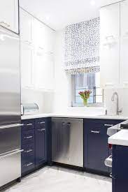 Painting the backs of the white upper cabinets blue carries the lighthearted color upward. Pin On Kitchens