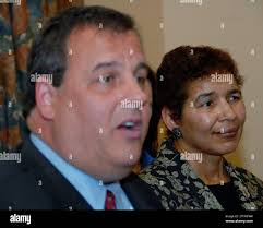 New Jersey Governor-elect Christie (R), left, announces his selection of  Paula Dow, right, to be Attorney General in his administration during a  press conference in Trenton, NJ