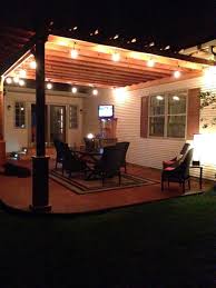 Our Backyard Oasis Stained Concrete Pergola Lights And Of Course A Tv Pergola Lighting Backyard Oasis Pergola