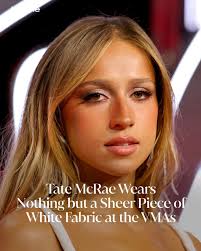 Miss possessive has arrived to the 2025 #VMAs in nothing but a sheer piece  of fabric. Click the link below to see #TateMcRae's full outfit ⬇️.