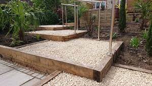 Use a slope to create garden art! How To Make The Most Of A Sloping Garden Silverbirch Gardens