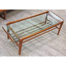 Shop danish modern coffee table at urban outfitters today. A Retro Danish Style Coffee Table With Glass Top And Lower Rails Length 123cm Depth 47cm Height