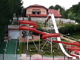 We can design a swingset or playset that will be your own private safe playground. The Ultimate Backyard Pool Slide Gtage