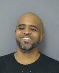 Man charged with kicking two county police officers