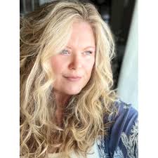 Two weeks after my partner of 30 years died, I walked into my bathroom to  see two rainbows dancing across the window. Without thinking, I ran and  grabbed my camera and shot