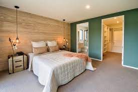 Bright white cabinetry with mirrored fronts helps to keep the space feeling bright and airy. Master Bedroom With Ensuite And Walk In Wardrobe Contemporary Bedroom Christchurch By Fraemohs Homes Houzz Au