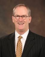 Mr. Harry D. Revell, Senior Partner