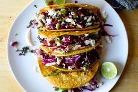 Bobby adds a tangy sauce and olive relish to the cooked fish to ensure a burst of flavor in every bite. Crisp Black Bean Tacos With Feta And Slaw Smitten Kitchen