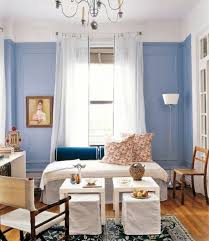 The moss green pillows and dove gray couches work to create a tranquil space. Powder Blue Wall Paint Water Colored Interior Interior Design Ideas Avso Org