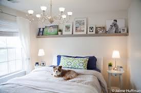 This is my bookshelf over my bed you can even see my little l plushie that i just got.isn't he cute?! Photo Shelf In A Bedroom Ikea Inspiration This Would Look Great In My Guest Room Guest Bedroom Update Simple Bedroom Home Bedroom