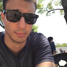 Who would win in a fight, Might Guy with the 9 tails chakra or Orochimaru  with the Rinnegan?