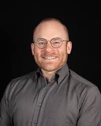 ABOUT — PETER W. MITCHELL