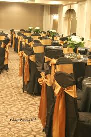 Black Banquet Chair Cover With Antique Gold Satin Sash Burnt Orange Weddings Black Wedding Decorations Black Party Decorations