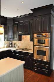 They can protrude several inches beyond the cabinets and make the kitchen look cramped, dated, and unsightly. Painting Soffits Same Color As Cabinets Adding A Small Piece Of Trim Slightly Above Cabinets And Adding Mol Kitchen Design Small Home Kitchens Kitchen Soffit