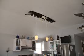 It will require a lot of time. Waterski Lighting A Pair Of Antique Wooden Water Skis Made Into A Light Fixture Over A Kitchen Island Light Fixtures Lighting Ceiling Lights
