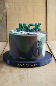 The decoration on the cake are toys the parents. Army Cake Iced By Kez Army Cake Army Birthday Cakes Boy Birthday Cake