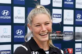 Carlton AFLW players Grace Egan, Tayla Harris and Lucy McEvoy pose... News  Photo