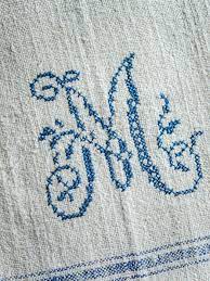 Cross stitch patterns for dishtowels. Easily Cross Stitch A Monogrammed Tea Towel Hgtv