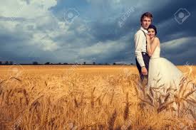 A preview of wedding photos from royce & aubree's wedding at blue sky lodge in breckenridge co on a beautiful july day. Beautiful Bride And Groom In Wheat Field With Blue Sky In The Background Wedding Photography Stock Photo Picture And Royalty Free Image Image 72127196
