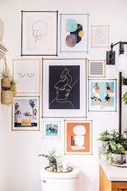 First, you'll want to use the 1/4″ tape to make a horizontal grid of lines that are far enough apart to fit your wide washi. Diy Washi Tape Gallery Wall Honestly Wtf