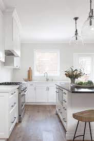 Image © usiremodeling.com another thing you can match with your white shaker cabinets is a black island. Matte Black Pulls On White Shaker Cabinets Transitional Kitchen