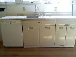 But was it possible to repaint painted kitchen cabinets and not have it look like crap? How To Paint Metal Cabinets Metal Kitchen Cabinets Painting Metal Cabinets Vintage Kitchen Cabinets
