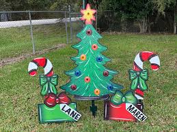 Ring in the holidays with unique decorating ideas for christmas and festive christmas party supplies from shindigz. Yard Art R Us Small Lighted Christmas Tree With 2 Small Candy Canes And 2 Personalized Presents Christmas Yard Decorations Facebook