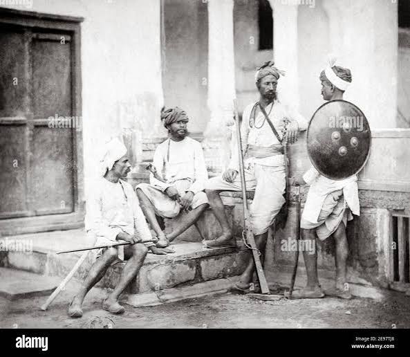 Late 19th century photograph - Chohan Rajputs, with gun and swords, India. Shepherd and Roberston photograph, 1860's Stock Photo - Alamy