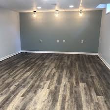 The bathroom has clean lines and a modern flair, while the bedroom has a patriotic color scheme. Modern Finished Basement Renovation Home