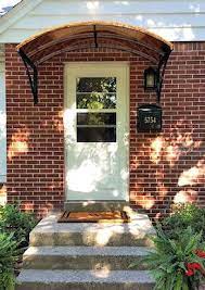 The Copper Eyebrow Door Awning With The Smith Scrolls In Eastchester Ny Custom Awnings Door Awnings Metal Awnings For Windows
