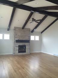 Maybe you would like to learn more about one of these? Faux Beams Highlight The Vaulted Ceiling The Beams And Mantel Were Stained A Charcoal Color To Pull Vaulted Ceiling Beams Faux Beams Ceiling Beams Living Room