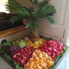 Easy way making fruit platter design for centerpiece in any occasion. It S The Little Creative Touches That Can Make The Party Like This Palm Tree Added To A Fruit Tray Fruit Platter Ideas Party Fruit Party Fruit Platter