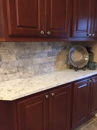 Cherry Kitchen Tumbled Travertine Backsplash With Maestro Quartz Cherry Cabinets Kitchen Trendy Kitchen Backsplash Kitchen Backsplash