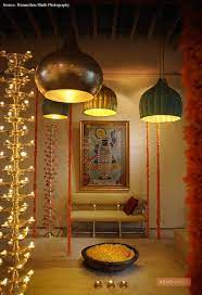 A pooja room can be made stunning with the addition of a false ceiling in wood to contrast the light colours of the wall. Pooja Room Lights Online
