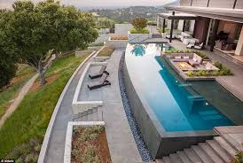 Sumptuous Surroundings With Its Infinity Pool And Rooftop Garden This Picture Perfect House Is The Ideal Cel Modern Pools Backyard Pool Swimming Pool Designs