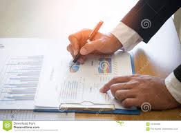 Business Man Analyzing Graph And Chart Document Report Stock